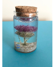 Resin flask containing a real dried thistle