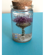 Resin flask containing a real dried thistle