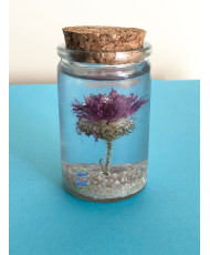 Resin flask containing a real dried thistle