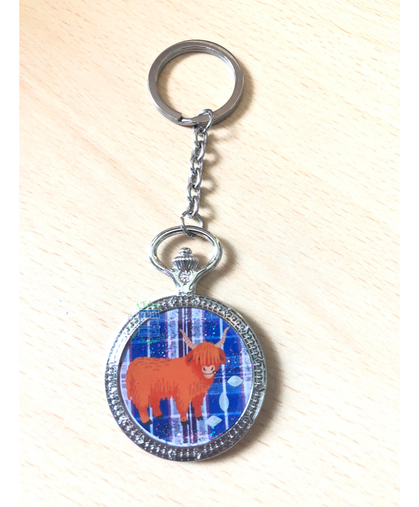 Porte-clés montre à gousset ronde vache Highland tartan bleu/violet